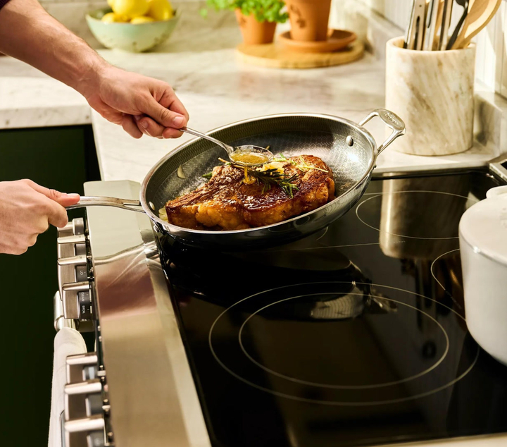man on cooking on stove